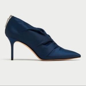 High heel ankle booties with gathered detail.